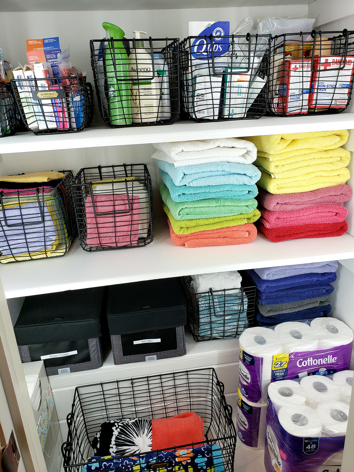 We unfolded and looked at each one, setting aside any that were looking old and ratty.   Again, she decided on how many sets of towels based on the number of people in her family and regular guests.  The towels that did not make the cut were donated to  the local animal shelter.